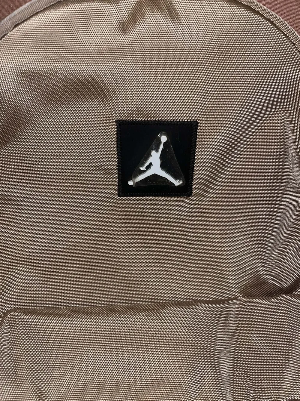 Jordan Two-Tone Tan and Black Backpack with Blue Accents